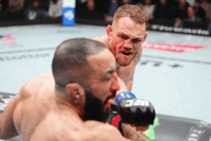 JDM celebrates victory over Belal Muhammad in the octagon.